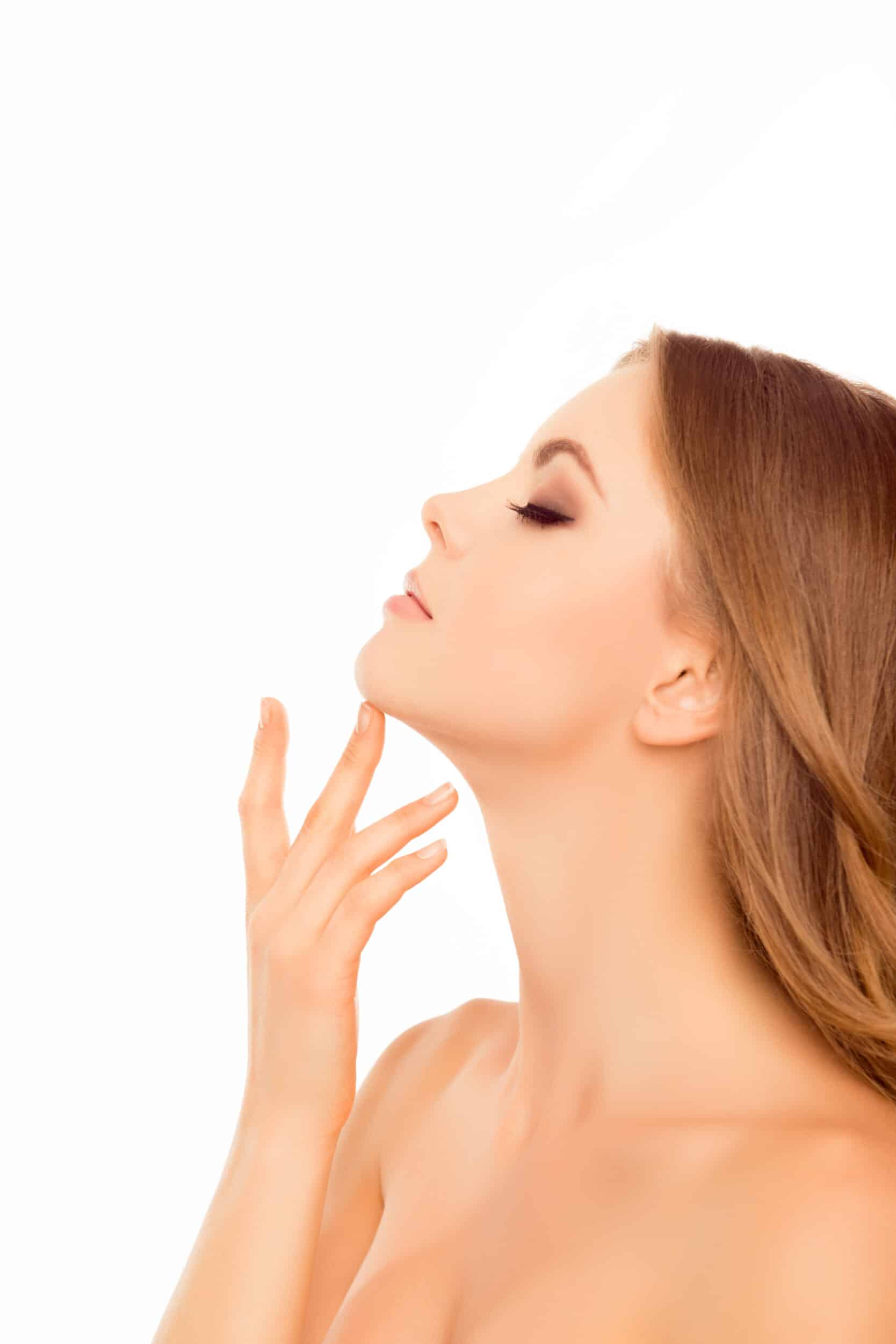 Side view portrait of beautiful sensitive woman touching her neck